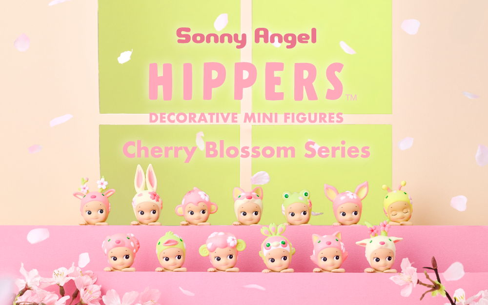 Product image shows "Sonny Angel HIPPERS Decorative Mini Figures Cherry Blossom Series" in text above the lineup of new product variants surrounded by cherry blossoms and petals. Top row from L to R: Reindeer, Rabbit, Monkey, Shiba, Frog, Fawn, and secret Honey Bee minifigure HIPPER. Bottom row, L to R: Dalmatian, Duck, Sheep, Peacock, Cat and Goat